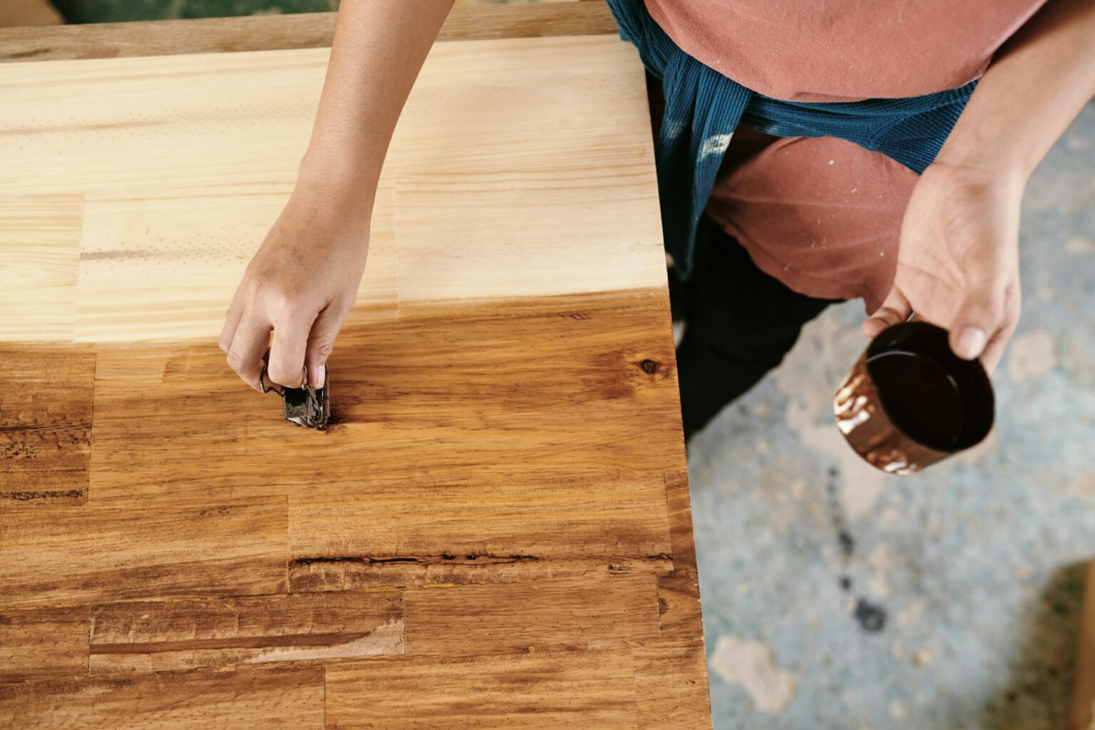 Carpenter applying wood lacquer